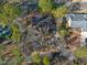 Bird's eye view of roof showing dark shingles and surrounding neighborhood with mature trees at 573 Broadmoor Ct, Sanford, NC 27332
