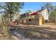 Relaxing backyard featuring a large deck, screened in porch, and charming stream at 573 Broadmoor Ct, Sanford, NC 27332