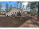 Expansive backyard with a large wooden deck, perfect for outdoor entertaining and relaxation at 573 Broadmoor Ct, Sanford, NC 27332