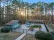 An expansive community pool with ample seating, mature landscaping and clubhouse at 573 Broadmoor Ct, Sanford, NC 27332