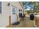 Outdoor deck features a grill, table, and chairs, perfect for enjoying the outdoors at 573 Broadmoor Ct, Sanford, NC 27332