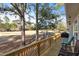 Spacious deck overlooking a lush green golf course, perfect for relaxation and outdoor enjoyment at 573 Broadmoor Ct, Sanford, NC 27332