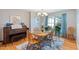 Charming dining room with hardwood floors, wooden furniture, and natural light at 573 Broadmoor Ct, Sanford, NC 27332