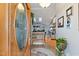 Welcoming foyer with a decorative front door, wood floors, bench, and views into the living spaces at 573 Broadmoor Ct, Sanford, NC 27332