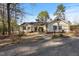 Charming home with a well-manicured lawn, front walkway, and mature landscaping at 573 Broadmoor Ct, Sanford, NC 27332