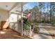 Charming covered front porch featuring brick flooring and white railing at 573 Broadmoor Ct, Sanford, NC 27332