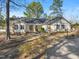 Inviting single-story home with mature trees and landscaping in a peaceful, residential setting at 573 Broadmoor Ct, Sanford, NC 27332
