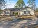 Charming ranch-style home with well-maintained lawn and welcoming walkway to the front door at 573 Broadmoor Ct, Sanford, NC 27332
