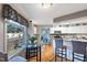 Eat-in kitchen features a glass table and chairs, and large windows overlooking the deck and yard at 573 Broadmoor Ct, Sanford, NC 27332