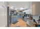 Modern kitchen with stainless steel appliances, granite countertops, and hardwood floors at 573 Broadmoor Ct, Sanford, NC 27332