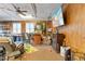 Cozy living room with wood paneling, bar, fireplace and large screen TV for entertainment at 573 Broadmoor Ct, Sanford, NC 27332