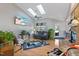 Inviting living room featuring hardwood floors, skylights, and a cozy seating arrangement at 573 Broadmoor Ct, Sanford, NC 27332