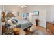 Vaulted ceiling main bedroom featuring calming colors, soft lighting and ensuite bathroom entrance at 573 Broadmoor Ct, Sanford, NC 27332