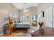 Relaxing main bedroom with a vaulted ceiling, neutral colors, ceiling fan and ensuite bathroom at 573 Broadmoor Ct, Sanford, NC 27332
