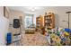 Cozy home office featuring bookshelves, comfortable seating, and natural light, perfect for work or relaxation at 573 Broadmoor Ct, Sanford, NC 27332