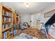 Comfortable home office area with wooden bookshelves and a view into the entryway of the home at 573 Broadmoor Ct, Sanford, NC 27332