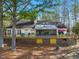 A charming rear exterior with a spacious wooden deck, screened-in porch and backyard at 573 Broadmoor Ct, Sanford, NC 27332