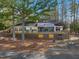 A spacious rear exterior with large wooden deck and screened in porch area at 573 Broadmoor Ct, Sanford, NC 27332