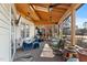 Inviting screened porch with comfortable seating and a view of the outdoors is perfect for relaxing at 573 Broadmoor Ct, Sanford, NC 27332
