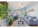 Bright sunroom with lots of windows, hardwood floors, and comfortable seating at 573 Broadmoor Ct, Sanford, NC 27332