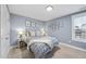 Cozy bedroom with neutral walls, bedside tables with lamps, and natural light from the window at 656 Groveview Wynd, Wendell, NC 27591