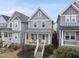 Charming two-story home with a welcoming porch and a well-maintained front yard at 656 Groveview Wynd, Wendell, NC 27591