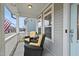 Inviting front porch featuring wicker seating and a view of the neighborhood at 656 Groveview Wynd, Wendell, NC 27591