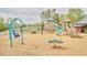 Community playground for with swings, slides, a climbing structure, and a picnic table, a great place to play at 656 Groveview Wynd, Wendell, NC 27591