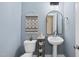 Stylish powder room with decorative details and contemporary fixtures at 656 Groveview Wynd, Wendell, NC 27591