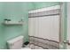 Cozy bathroom featuring green walls, and a shower/tub with a decorative shower curtain at 702 Great Eno Path, Hillsborough, NC 27278