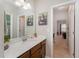 Clean bathroom featuring a vanity with sink and view into the hall at 702 Great Eno Path, Hillsborough, NC 27278