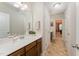 Clean bathroom featuring a vanity with sink and view into the hall at 702 Great Eno Path, Hillsborough, NC 27278