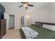 Primary bedroom with a door to the bathroom and neutral colors at 702 Great Eno Path, Hillsborough, NC 27278