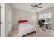 Cozy bedroom with bed, desk, chair, and natural light at 702 Great Eno Path, Hillsborough, NC 27278