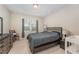 Cozy bedroom with a queen bed, dresser, and a window offering natural light at 702 Great Eno Path, Hillsborough, NC 27278