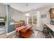 Dining room with a rustic wooden table set and a large window providing natural light at 702 Great Eno Path, Hillsborough, NC 27278