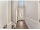 Bright hallway with a soaring ceiling, board and batten detail, and wood-look flooring at 702 Great Eno Path, Hillsborough, NC 27278
