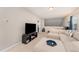 Open living room area with sectional sofa, television, and natural light at 702 Great Eno Path, Hillsborough, NC 27278