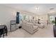 Bright living room with large sectional sofa, and lots of natural light at 702 Great Eno Path, Hillsborough, NC 27278