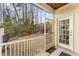 Relaxing screened porch with a view of the backyard and surrounding trees at 702 Great Eno Path, Hillsborough, NC 27278