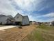 New construction home with light siding, two-car garage, and a spacious yard in a growing community at 720 Hipwood Dr, Zebulon, NC 27597