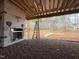 Outdoor porch with outdoor fireplace in construction at 7429 Wexford Woods Ln, Wake Forest, NC 27587