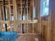 In-progress bathroom with plumbing visible, wood framing, and potential for customized finishes and features at 7429 Wexford Woods Ln, Wake Forest, NC 27587
