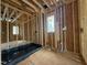 Bathroom in construction phase with natural light at 7429 Wexford Woods Ln, Wake Forest, NC 27587