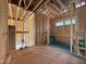 Unfinished bathroom displaying a prepped shower base and wall framing, awaiting final touches and customization at 7429 Wexford Woods Ln, Wake Forest, NC 27587