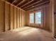 Unfinished bedroom showing a spacious layout with natural light ready for personalization and design touches at 7429 Wexford Woods Ln, Wake Forest, NC 27587