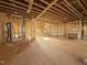 Open-concept home interior featuring exposed beams, wood framing, and stairs to the upper level at 7429 Wexford Woods Ln, Wake Forest, NC 27587