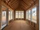 New sun room under construction with large windows allowing for an abundance of natural light at 7429 Wexford Woods Ln, Wake Forest, NC 27587