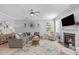 Bright, open living area with a fireplace and comfortable seating at 749 Lake Artesia Ln, Fuquay Varina, NC 27526