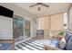 Inviting screened-in porch area with comfortable seating and outdoor access at 749 Lake Artesia Ln, Fuquay Varina, NC 27526